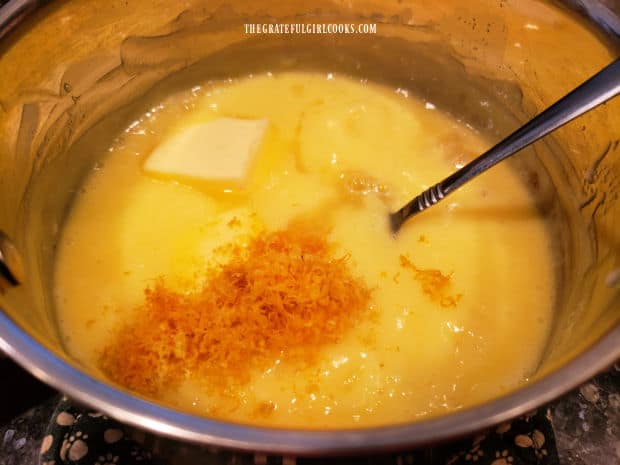 Butter, lemon zest, and lemon juice are added to the saucepan to make the pie filling.