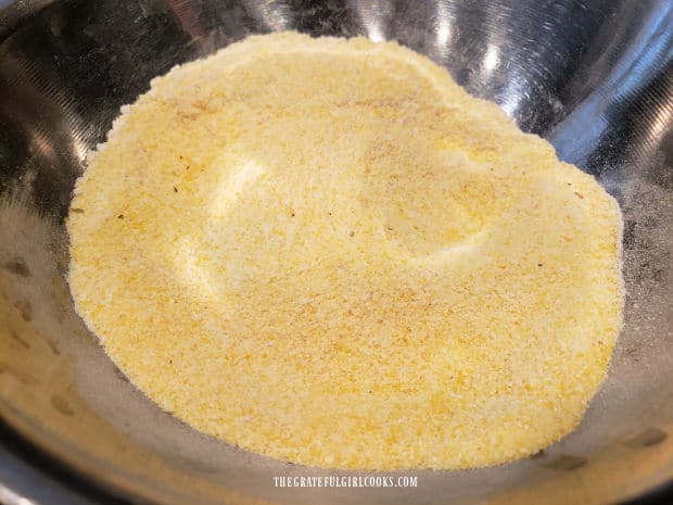 Cornmeal and flour is combined to coat the outside of fish fillets.