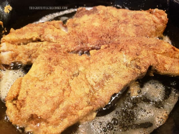 Southwestern fried rockfish is browned and crispy after frying in hot oil.