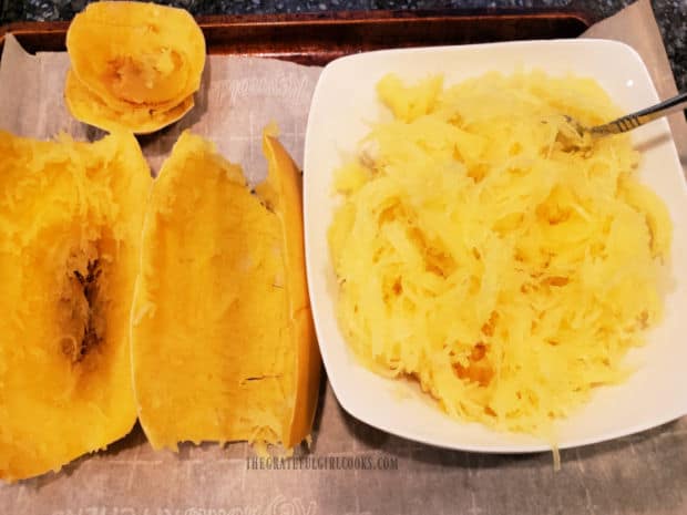 A large white bowl on the right, filled with roasted spaghetti squash strands.