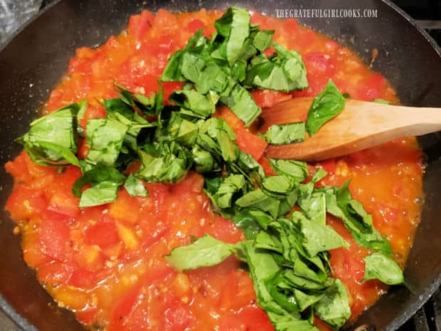 Fresh chopped basil is added to tomatoes and garlic for Spaghetti Sauce Italiano.