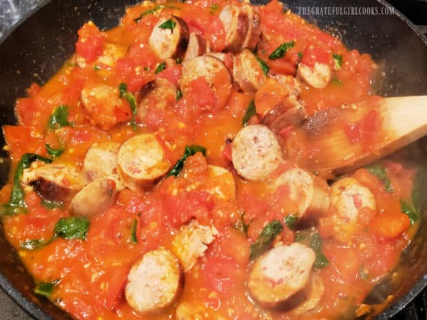 Cooked Italian sausage is added to the skillet with the tomato basil sauce and heated through.