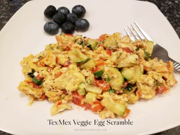 TexMex Veggie Egg Scramble is a delicious and filling breakfast, flavored with zucchini, scallions, bell peppers, tomatoes and spices.