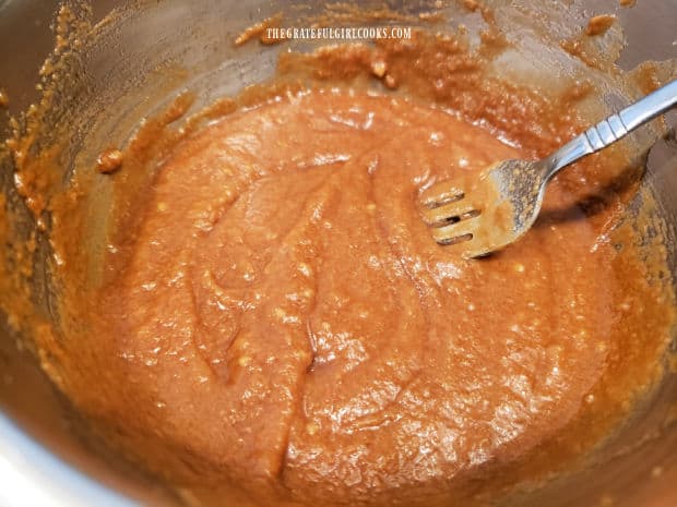 Peanut sauce for the coleslaw is mixed together until fully combined.