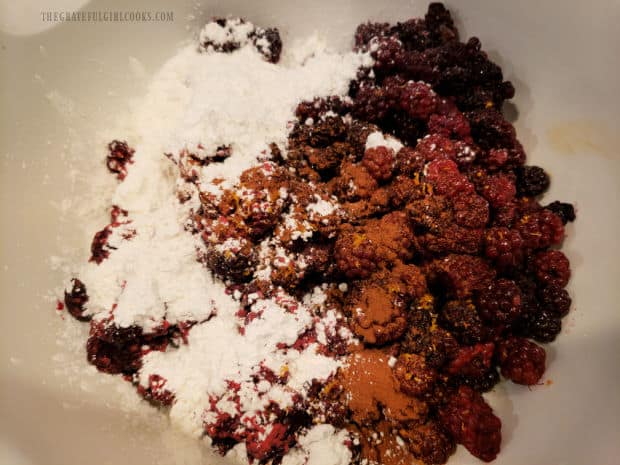 Blackberries are tossed with sugar, flour, cinnamon, lemon juice and zest until combined.