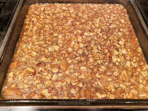 The batter for the baked oatmeal is poured into an 8x8 baking pan.