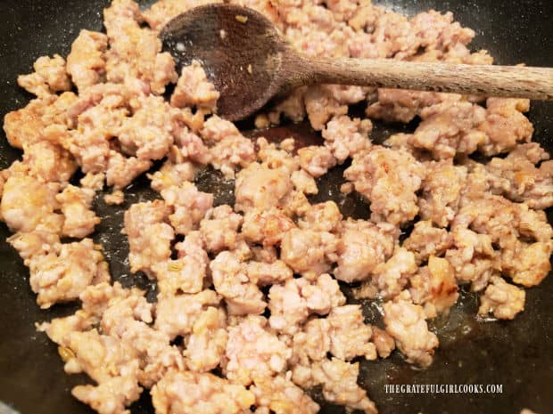 Once the Italian sausage is cooked and no longer pink, it is removed from the skillet.