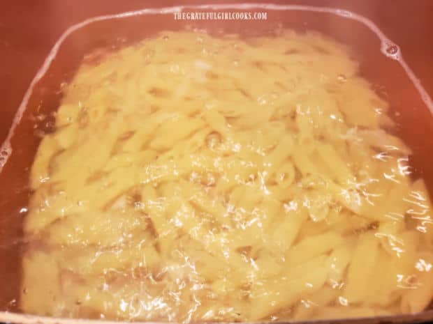 Penne pasta is cooked in large pan, according to package instructions, then drained.
