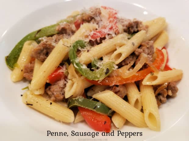 Penne, Sausage and Peppers is an easy, yummy meal! Italian sausage, onions, spices and red/green bell peppers in pasta, topped with Parmesan!