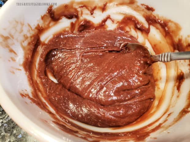 Flour is folded into the thick batter for the air fryer chocolate lava cake.