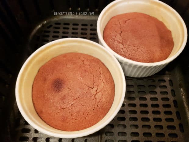 Air Fryer Chocolate Lava Cake is cooked in an air fryer basket for 10 minutes.