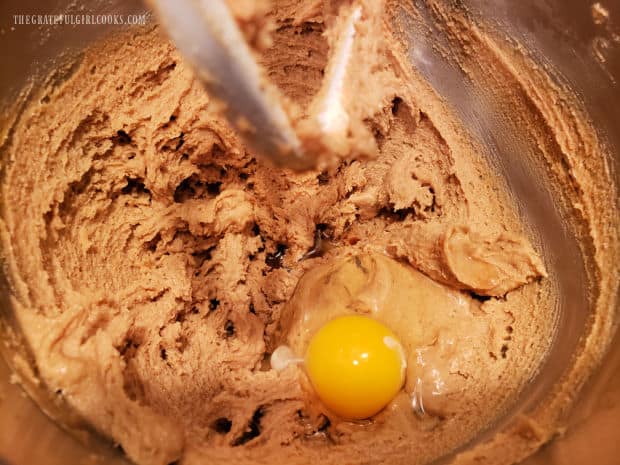 Four eggs are added to the batter, one at a time, then mixed in.