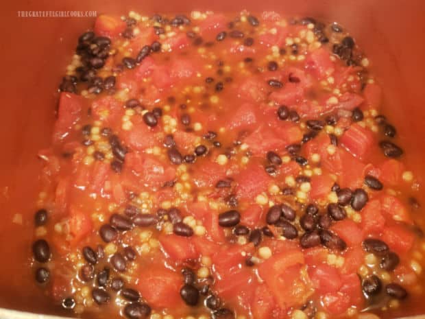 Easy black bean stew cooks and broth is added to thin it out, if desired.