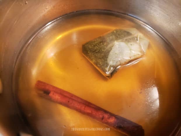 A peppermint tea bag and cinnamon stick are steeped in boiling water (covered) for 5 minutes.