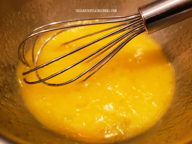 Eggs are whisked with sugar until they're combined.