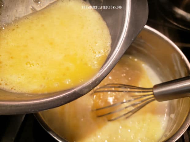 Tempered eggs are whisked back into the pan of hot tapioca pudding.