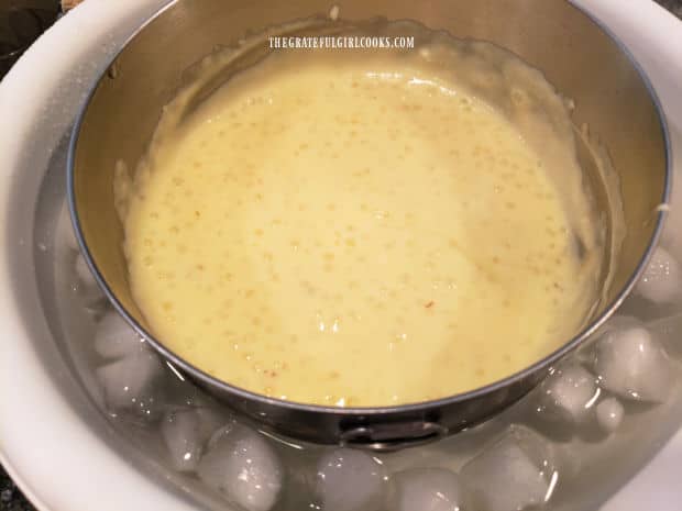 A bowl of old-fashioned tapioca pudding rests on a bowl of ice water to cool it quickly.