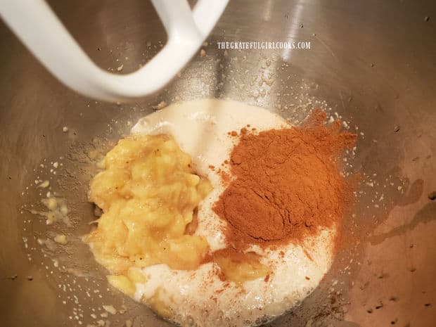 Ground cinnamon and mashed bananas are mixed into the yeast mixture.