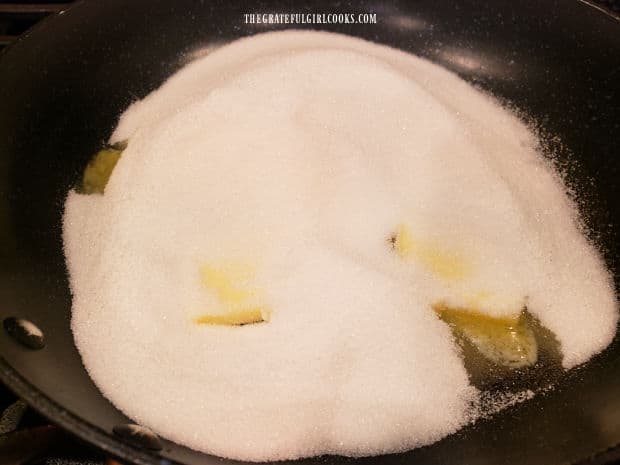 Butter and granulated sugar are heated in a large skillet.