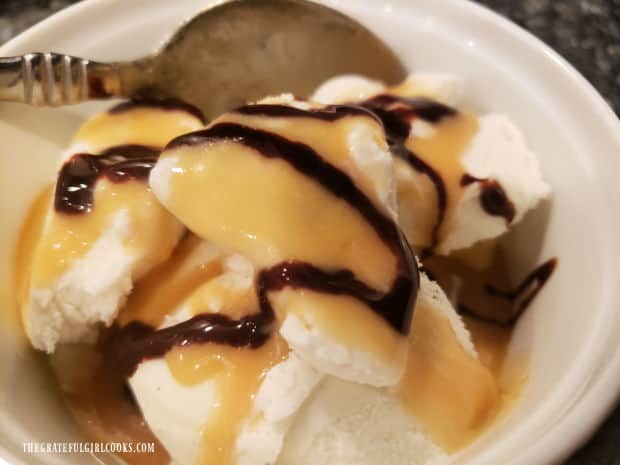 Homemade caramel sauce is drizzled over vanilla ice cream.