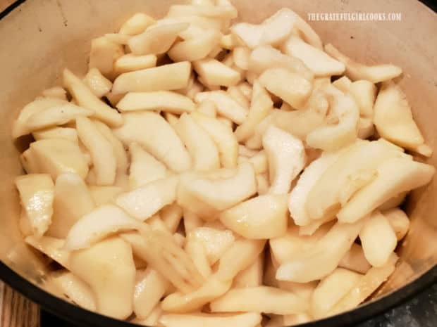 Twelve cups of peeled and sliced pears in a large soup pot, ready to cook.