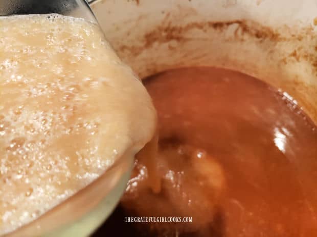 The pureed pears are added back into the cinnamon sugar and juices in pan.
