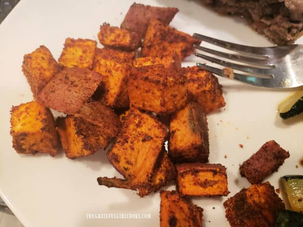 Spicy Sweet Potato Bites are served as a side dish, on a white plate.