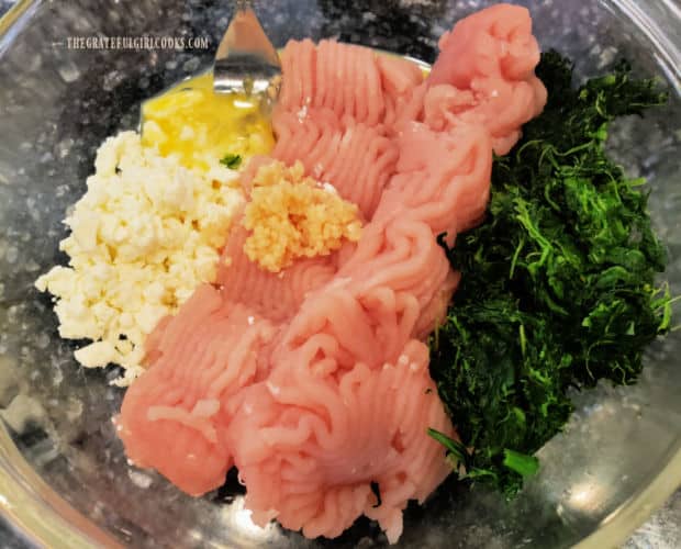 The ingredients for the turkey burgers are placed in a large bowl for mixing.