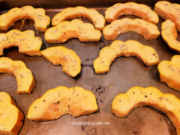 Acorn squash is sprinkled with Parmesan cheese and baked in a single layer for 20 minutes.