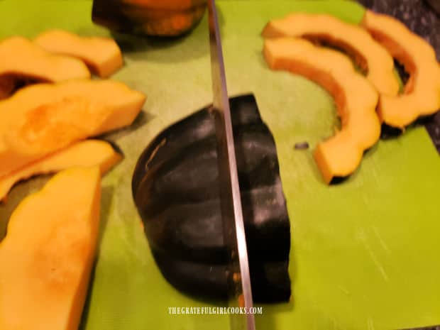 One inch slices are cut from each of the acorn squash halves.