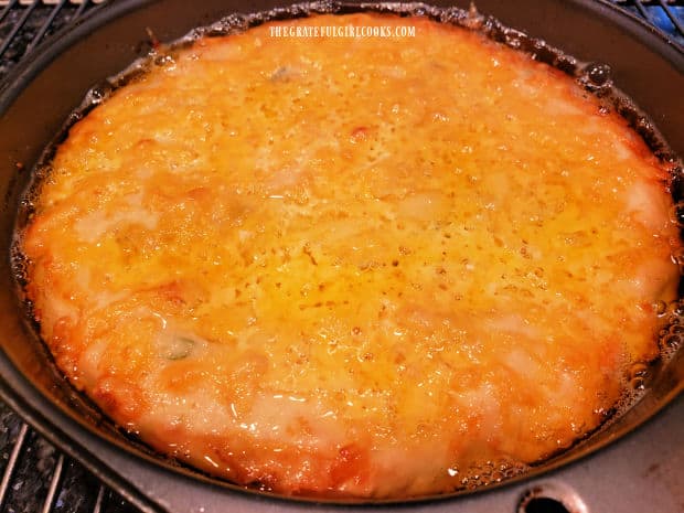 When finished baking, the bread is set and golden brown in color on the top.