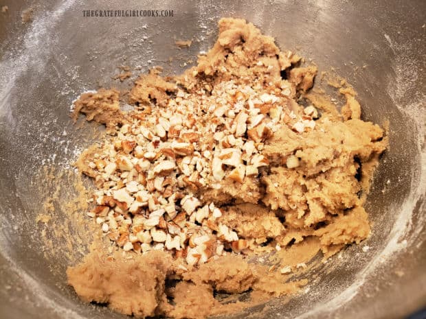 Chopped pecans (or walnuts) are stirred into the prepared dessert bars dough.