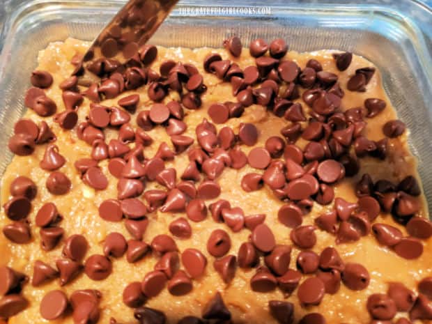 After baking for 2 minutes, a knife is used to swirl the softened chocolate chips through the dough.