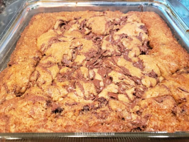 Golden brown and firm on top, the chocolate chip swirl bars are removed from oven.