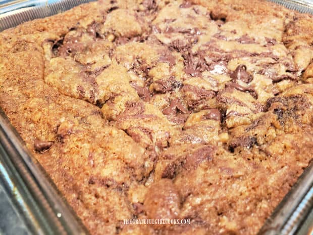 Chocolate chip swirl bars, in baking dish, cooling down before slicing.