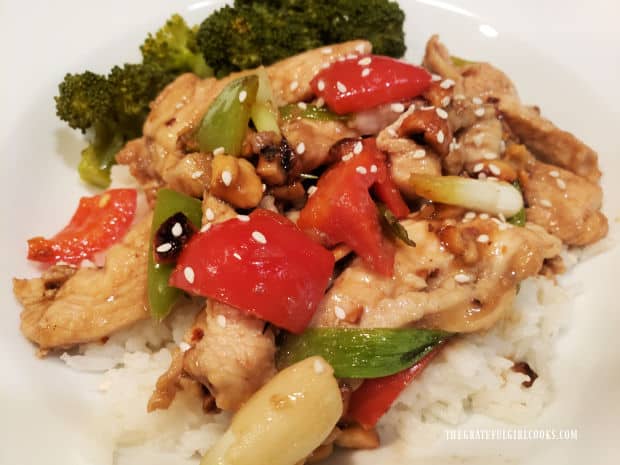 Sesame seeds are sprinkled on top of the Szechuan chicken before serving.