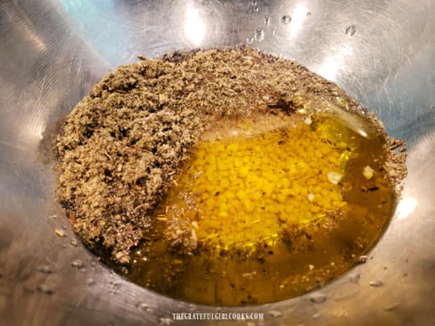 Salad dressing ingredients are placed in a small bowl before combining.