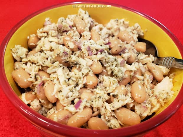 A bowl filled with Tuscan Cannellini Tuna Salad is ready to be served.