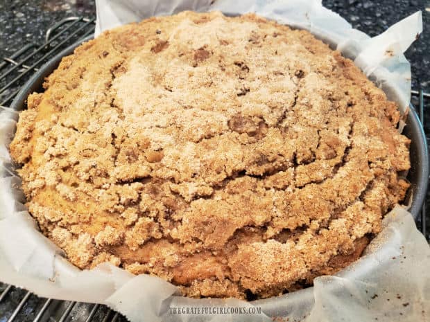 After baking, the banana streusel coffeecake cools in the pan, on a wire rack.