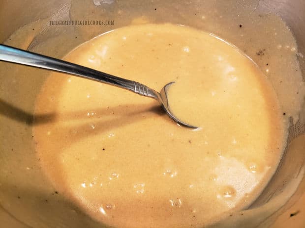 Mashed bananas are added to the batter and mixed until the batter becomes smooth and thick.