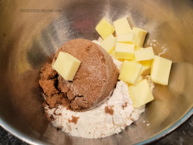 Flour, salt, brown sugar, cinnamon and cold butter are placed in bowl to combine into topping.