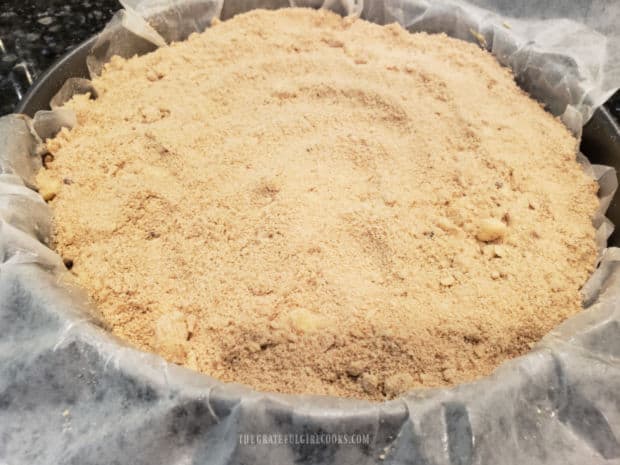 Streusel topping is sprinkled over the entire top surface of the coffeecake.