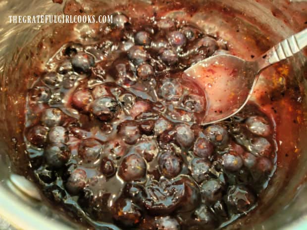 A saucepan with the finished blueberry dessert sauce, ready to be used on desserts.