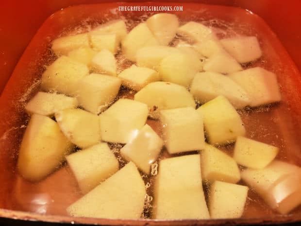 Peeled and cubed potatoes are boiled until tender.