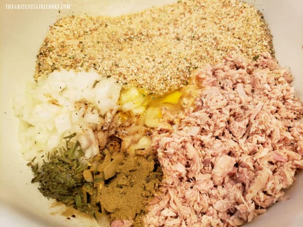 Turkey, bread crumbs, egg, onions and spices are placed in large mixing bowl and combined.
