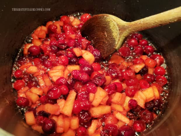 Cranberry/apple mixture is cooked 7-10 minutes or until cranberries pop or burst open.
