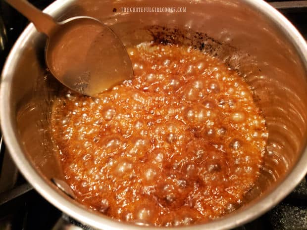 Caramel sauce is boiled for two minutes before being removed from heat.