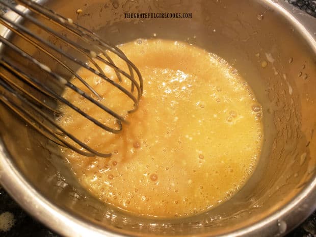 A whisk or electric mixer can be used to combine the creamy sesame vinaigrette ingredients.