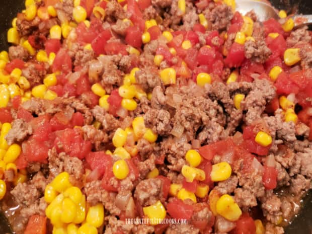 The ground beef filling for the easy tamale pie cooks for 15 minutes in skillet.