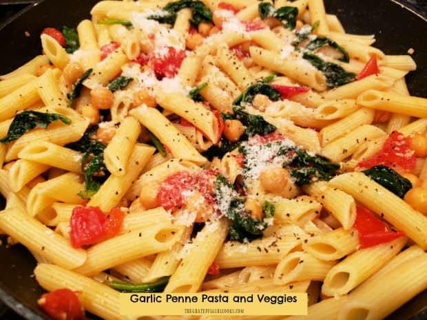 Garlic Penne Pasta And Veggies is a meatless pasta dish with garlic, spinach, tomatoes, chickpeas and Parmesan. It's ready in 20 minutes!